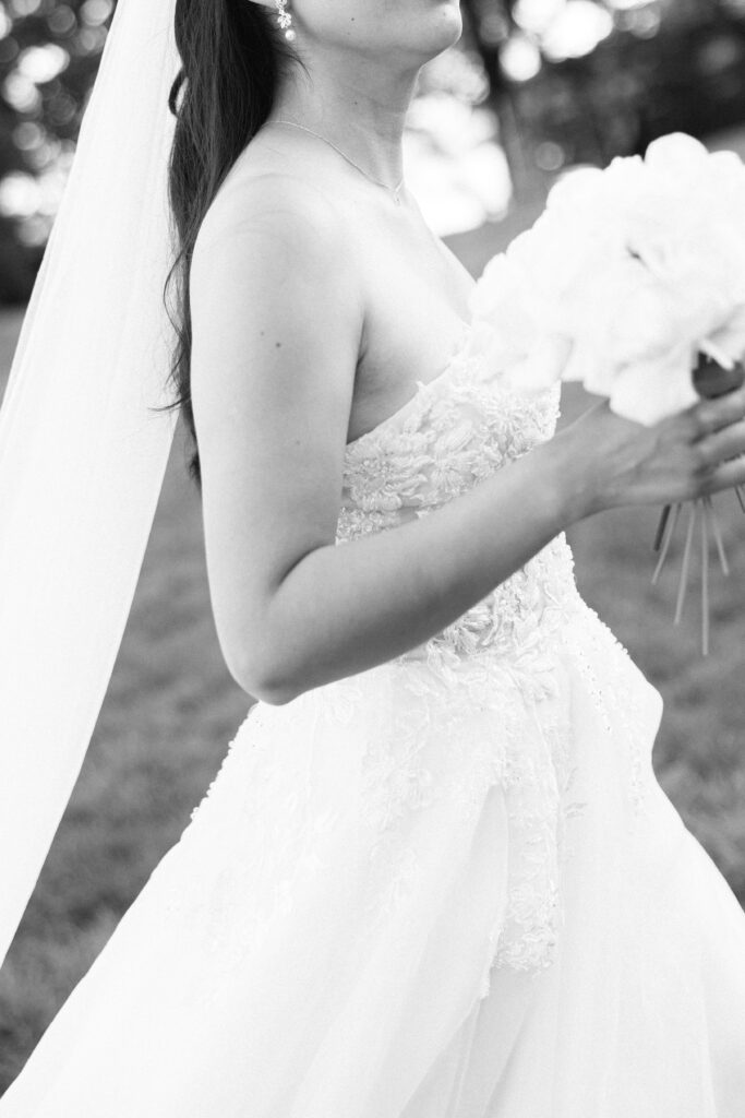 Black and white photo of bride enjoying her day