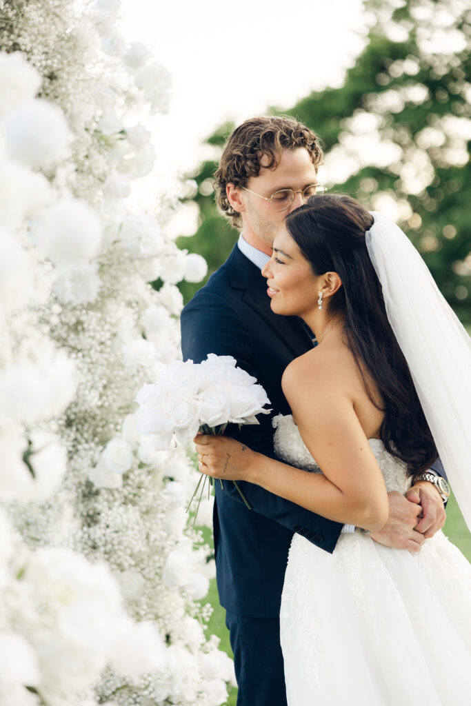 Elegant bride and groom by the ocean at Misselwood